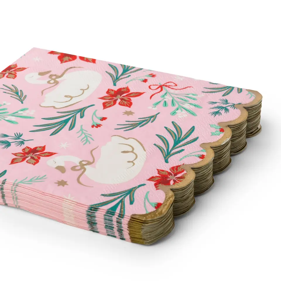 A stack of pink Swan Print napkins with a scalloped gold edge